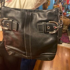Medium Leather COACH purse.